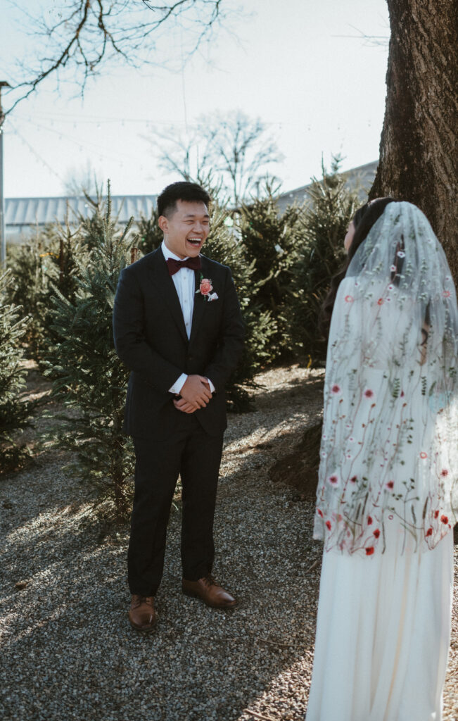 A grooms reaction to seeing his bride for the first look. Terrain at Styers.