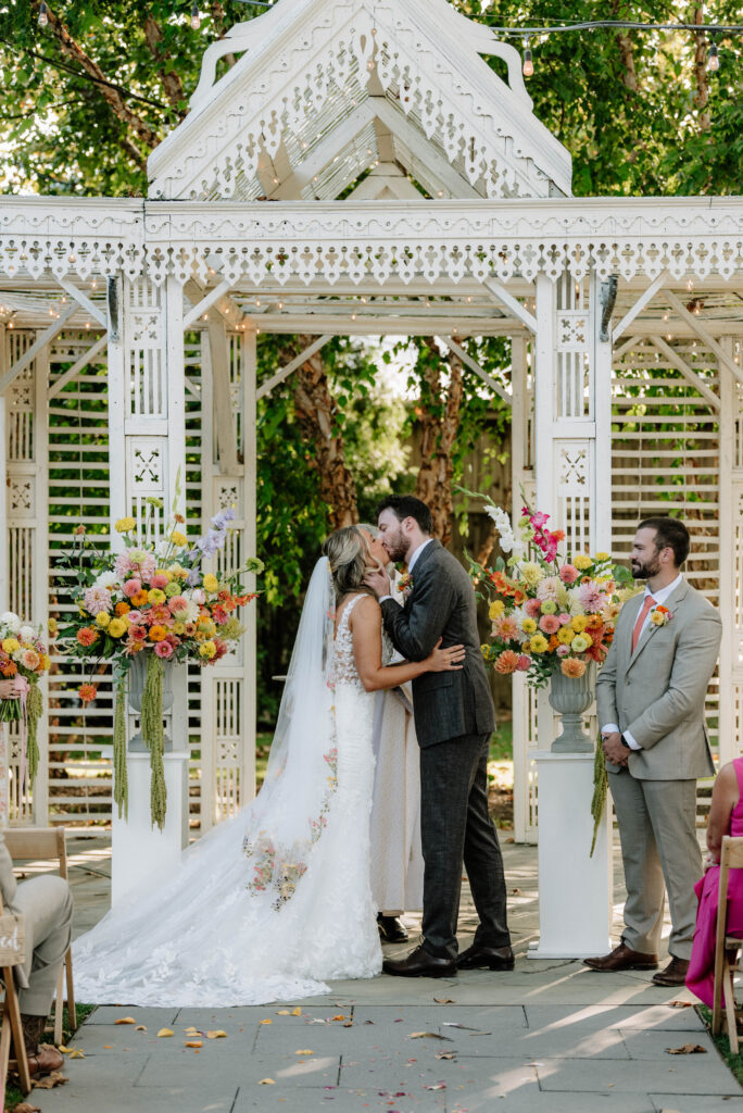 Wildflower and colorful wedding ceremony at Terrain Gardens at Styers.