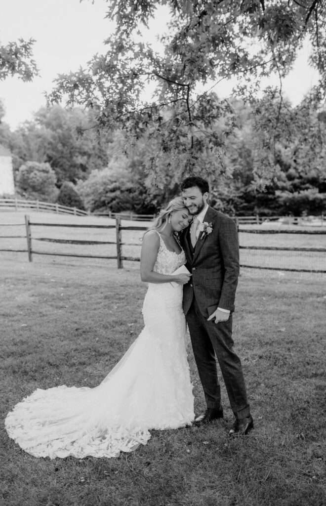 Bride and groom hug after their first look at the Inn at Grace Winery in Glen Mills, PA