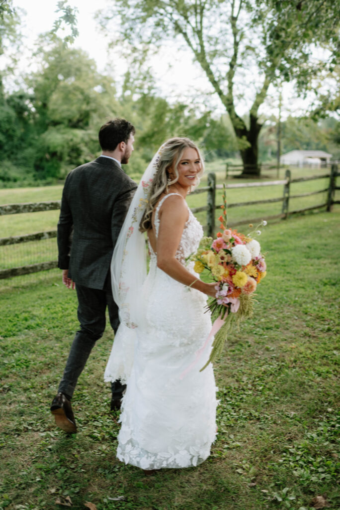 Bride and groom walking around at the Inn at Grace Winery in Glen Mills, PA. Documentary style wedding photography near Philadelphia, PA.